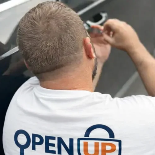 Open Up Locksmith technician unlocking a car door in Seattle